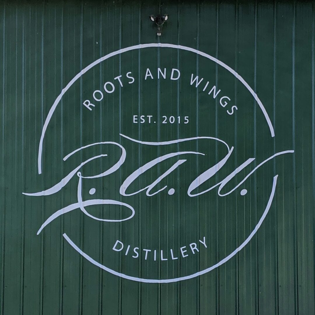 Roots and Wings Distillery Sign